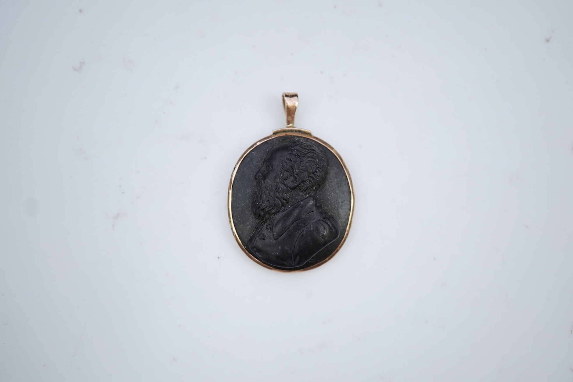 An unusual lava cameo pendant, late 19th century